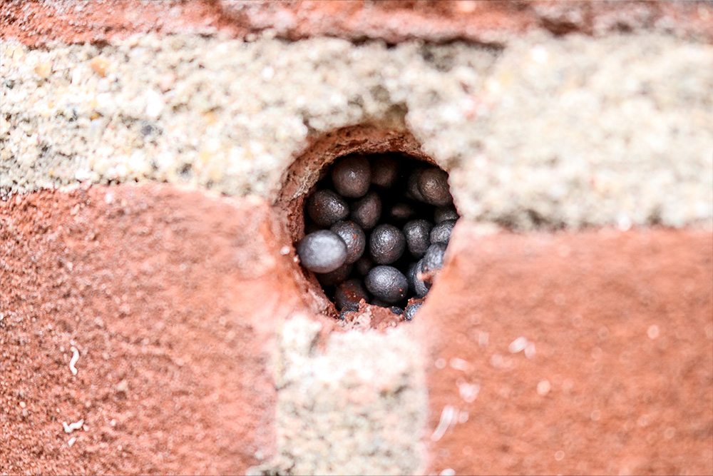 Spouwmuurisolatie parels in de muur